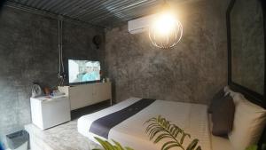 Et tv og/eller underholdning på บ้านมะนาวรีสอร์ท เกาะล้าน