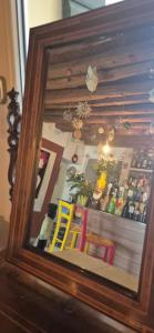 a picture of a bar in a wooden frame at Locanda Toronto in Moriago della Battaglia