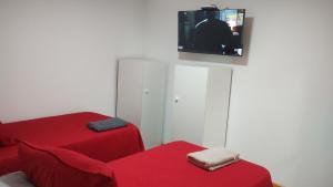 Et tv og/eller underholdning på Hostal GYT + 17 billeder