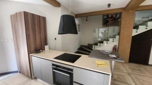a kitchen with a sink and a counter top at Beach House at Kokrobite in Kokrobite