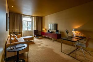 a living room with a couch and a table at Pestana Palacio do Freixo, Pousada & National Monument - The Leading Hotels of the World in Porto +60 photos