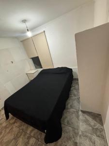 En eller flere senge i et værelse på Departamento Aqualuna