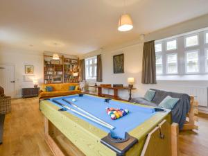 a living room with a pool table in it at School House in Ivybridge