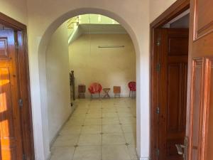 an archway in a hallway with a table and chairs at Musa house D ground in Faisalabad