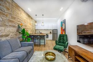 a living room with a couch and a table at Olga Premium Apartments in Limassol