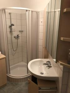 a bathroom with a sink and a shower at Sonnenalpe ckpk in Hermagor