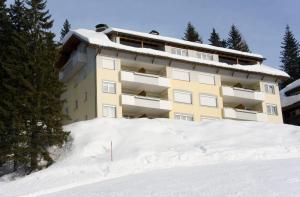 a building on top of a snow covered slope at Sonnenalpe ckpk in Hermagor