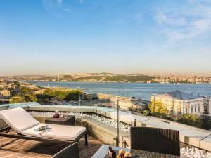 a balcony with a view of the water at Swissotel The Bosphorus Istanbul in Istanbul