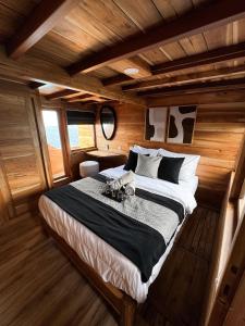 a bedroom with a large bed in a boat at Shared Boat Komodo 3 days 2 Night in Komodo Labuan Bajo Airport