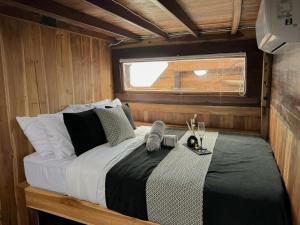 a bedroom with a bed in a boat at Shared Boat Komodo 3 days 2 Night in Komodo Labuan Bajo Airport