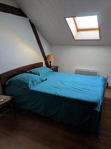 Postel nebo postele na pokoji v ubytování Maison des lacs