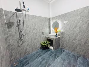a bathroom with a shower and a sink and a mirror at Sea Breeze Heaven in Tangalle +50 photos