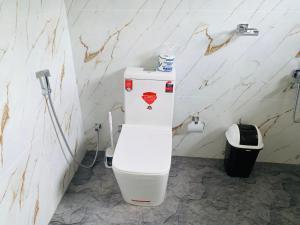 a bathroom with a white toilet in a room at water lily heaven in Tangalle +57 photos