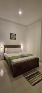 a bedroom with a large bed in a room at mountain retreat villa in Kandy
