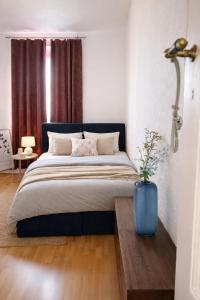 En eller flere senge i et værelse på Green Plants 24 7 Check In 4 Persons