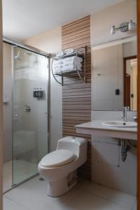 a bathroom with a toilet and a sink and a shower at qema Arequipa in Arequipa
