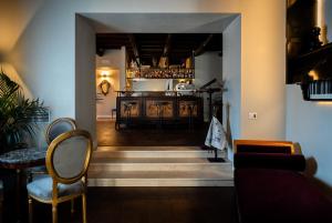 a hallway with a living room and a kitchen at Locanda Sibilla Luxury Suites in Tivoli