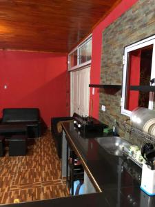 a kitchen with a counter and a sink in a room at Casa privada en Maimara in Maimará