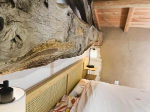 Postel nebo postele na pokoji v ubytování La Chouette - Ancienne grange entièrement rénovée 4 personnes