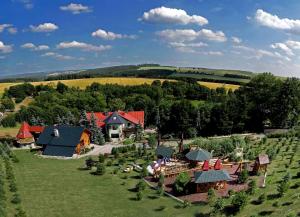 an aerial view of a house in a field with a train at Märchenhafte Ferienhäuser in Zaulsdorf