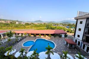 an overhead view of a swimming pool in front of a building at Marcsons Hotels and Resorts in Limbe