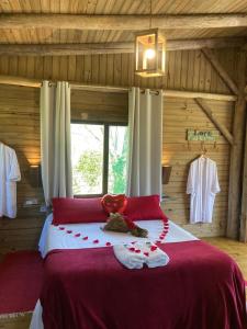 En eller flere senge i et værelse på Pousada Flor de Lótus dos Canyons