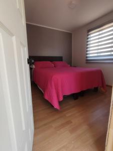 En eller flere senge i et værelse på Santo Bucalemu Lodge