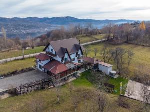 an aerial view of a house with a roof at Casa la Martin in Comarnic
