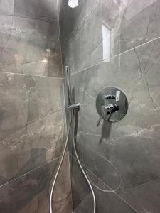 a shower with a glass door in a bathroom at Vila Melina in Himare +80 photos