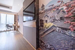 Et tv og/eller underholdning på Atour Hotel Guangzhou Panyu City Bridge