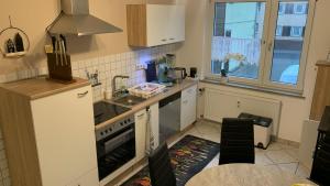 a kitchen with a sink and a stove top oven at Großes Juwel-Monteurzimmer-Privatzimmer in Wetzlar
