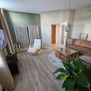 a living room with a couch and a table at Anno 1889 in Plauen