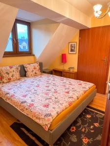 a bedroom with a bed in a room with stairs at Terra Siciliana in Łęczyca