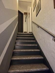 a stairway leading up to a hallway at Ferienwohnung Salza in Nordhausen
