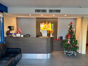 a christmas tree in the lobby of a restaurant at Blu Hotel in Buccinasco