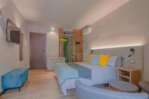 a bedroom with a king sized bed and a living room at Ca' De Carme' in Riomaggiore