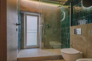 a bathroom with a shower and a toilet and a sink at Ca' De Carme' in Riomaggiore +28 photos