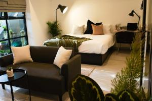 a bedroom with a bed and a couch at Tiny home Pana B Private residence 10mins beach in Bophut +15 photos