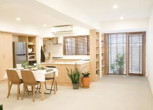 a kitchen and dining room with a table and chairs at Tiny home Pana B Private residence 10mins beach in Bophut