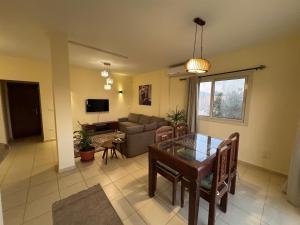 a living room with a table and a couch at Zowaar homes in Dahab