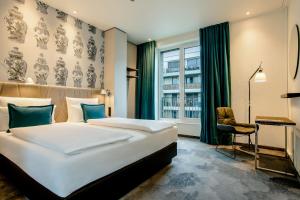 En eller flere senge i et værelse på Motel One Dresden am Zwinger
