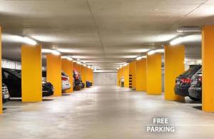 a parking garage with many cars parked in it at Ferenc Hotel Budapest in Budapest