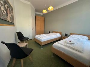 En eller flere senge i et værelse på Aparthotel Mariazellerhof