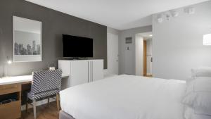 En eller flere senge i et værelse på Ultimate World Cup King Room Near the Stadium