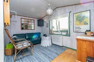 a living room with a couch and a table at BLE885-Ramdala-Ormen-langes-vaeg-10 in Ramdala