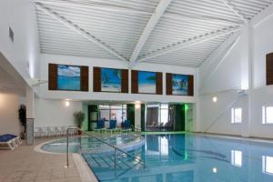 a large swimming pool in a large building at 3 Bed in Waren Mill oc-gd1928 in Bamburgh