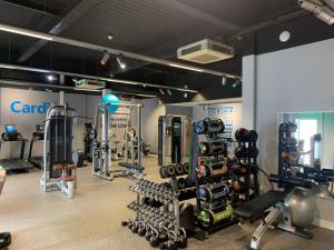 a gym with treadmills and weights in a room at 3 Bed in Waren Mill oc-gd1928 in Bamburgh