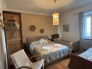 a bedroom with a bed and a living room at Cascina Teresina Monferrato Piscina in Cortazzone +65 photos