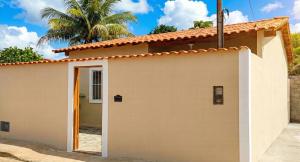 a house with a door in front of it at Casa da Villa Santa Rita in João Pessoa