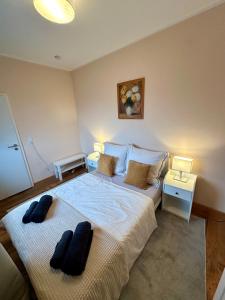 a bedroom with a large bed with two pillows on it at Stilvolles 2-Zimmer-Apartment in Bremen in Bremen